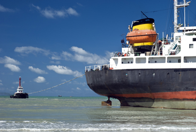 ship with tug boat